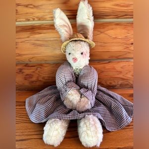 Sitting rabbit with straw hat and brooch